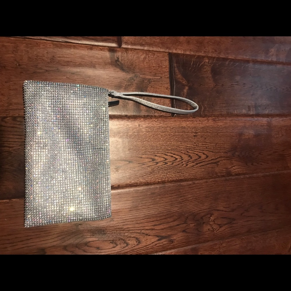 NWOT Charming Charlie silver clutch.